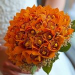 دسته گل عروس سیمبیدیم نارنجی با گل‌های نارنجی و زرد از گالری فلورانس